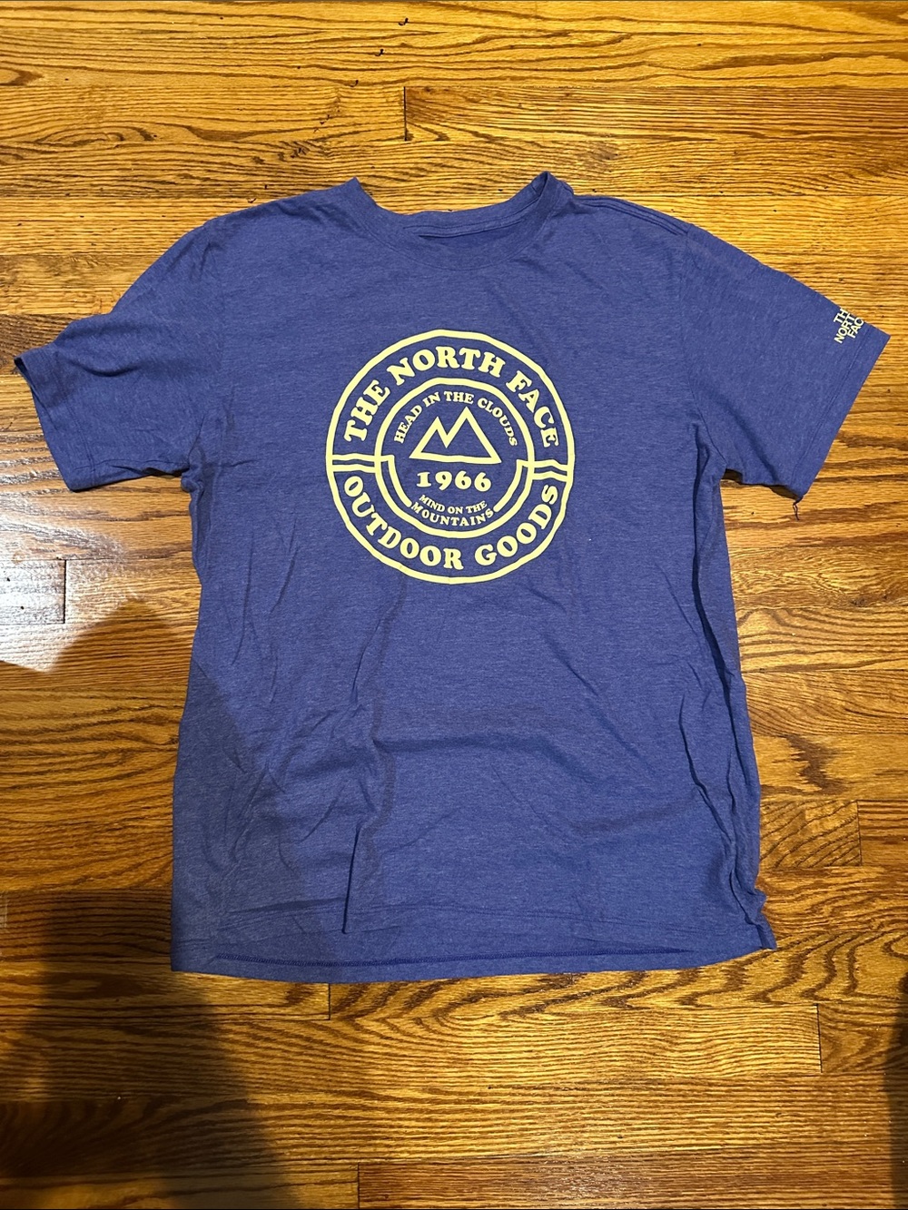 The North Face Purple Tee with Cream Outdoor Goods Logo